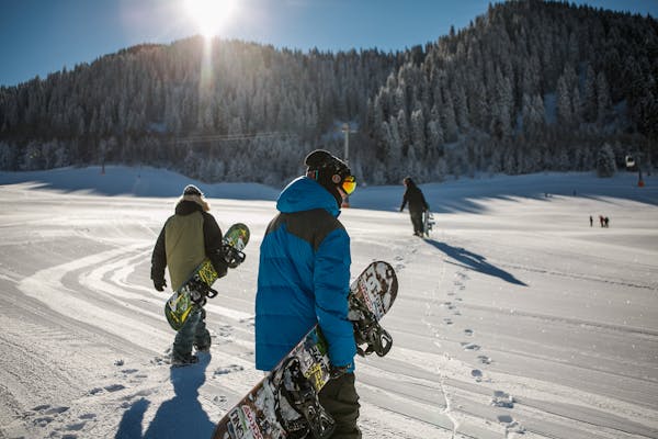 Person wearning blue and getting ready for Snowboarding in Texas